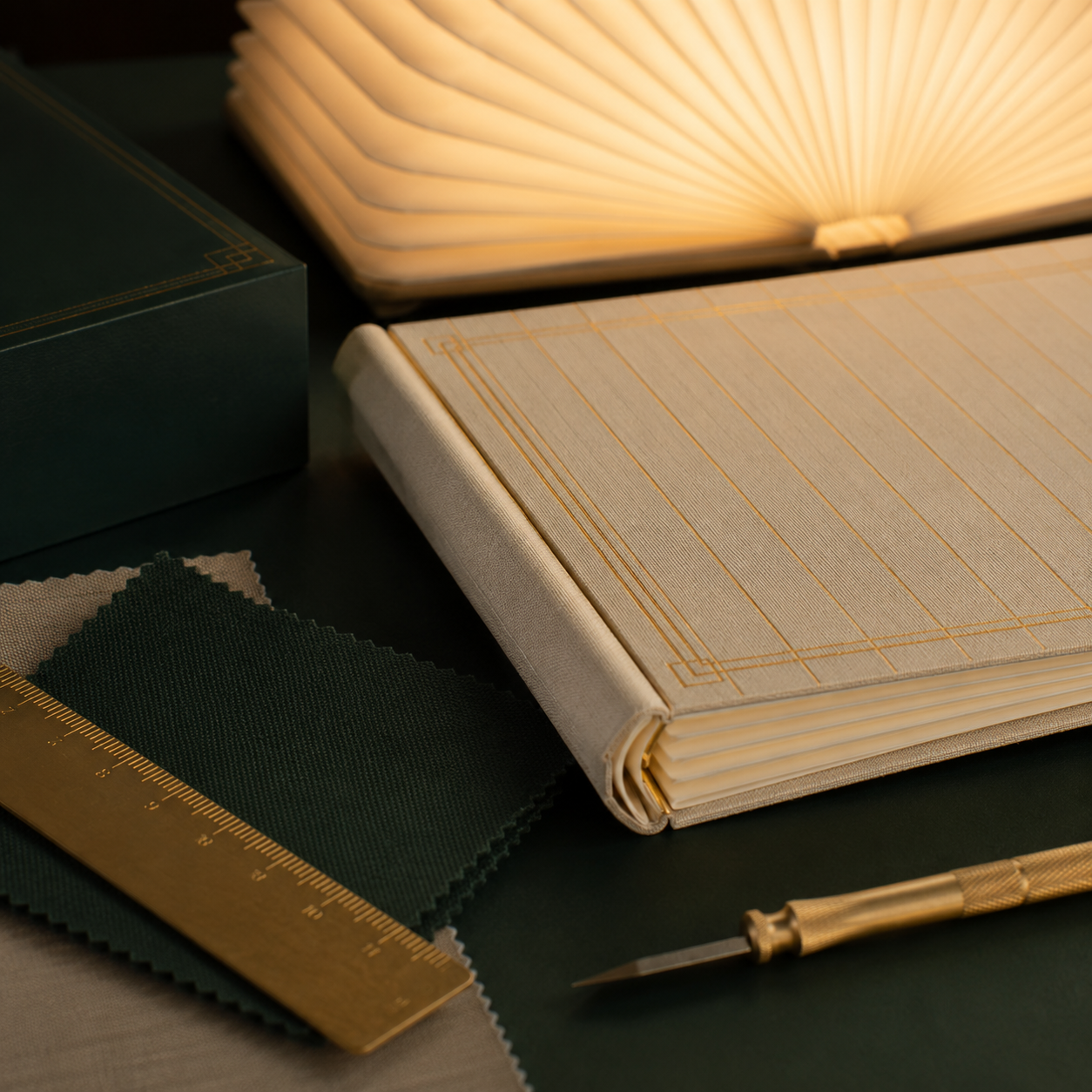 A warm reading lamp beside an open novel on a wooden surface
